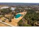 Breathtaking aerial view showcasing a pond surrounded by lush green trees, creating a tranquil setting at 96 Sam Alexander Rd, Douglasville, GA 30134