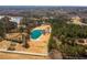 An aerial view of the property showcasing the pond, surrounding trees, and two homes at 96 Sam Alexander Rd, Douglasville, GA 30134