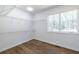 Walk-in closet with custom shelving and hardwood floors, illuminated by natural light at 96 Sam Alexander Rd, Douglasville, GA 30134