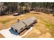 Newly renovated home featuring a metal roof, fresh landscaping, and an attached two-car garage at 96 Sam Alexander Rd, Douglasville, GA 30134