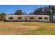 Charming single-story home featuring a metal roof, board and batten siding, and lovely wood shutters at 96 Sam Alexander Rd, Douglasville, GA 30134