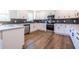 Bright kitchen featuring white cabinets, stainless steel appliances, and modern finishes at 96 Sam Alexander Rd, Douglasville, GA 30134