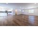 Open-concept living room flowing into a kitchen, showcasing modern flooring at 96 Sam Alexander Rd, Douglasville, GA 30134