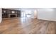 Spacious living room with hardwood floors, brick fireplace, built-in shelves and open concept design at 96 Sam Alexander Rd, Douglasville, GA 30134