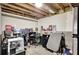 This basement features an exposed ceiling and unfinished walls with a gaming setup at 3337 Camens Way, Buford, GA 30519