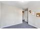 This bedroom boasts neutral walls and flooring with cat decor at 3337 Camens Way, Buford, GA 30519
