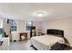 This bedroom includes two windows for natural light and a microwave and mini refrigerator for convenience at 3337 Camens Way, Buford, GA 30519