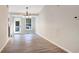Bright dining area features modern lighting, wood floors, and large windows for ample natural light at 3337 Camens Way, Buford, GA 30519