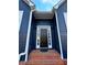 Close-up of the front door with sidelights and brick steps, framed by elegant white trim at 3337 Camens Way, Buford, GA 30519