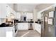 Kitchen with stainless steel appliances, white cabinets and dark countertops at 3337 Camens Way, Buford, GA 30519