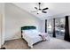 Main bedroom with large windows and ceiling fan at 3337 Camens Way, Buford, GA 30519