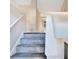 Carpeted stairs lead to the upper level, showcasing the home's functional layout at 3337 Camens Way, Buford, GA 30519