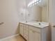 Bright bathroom featuring a double sink vanity and tile flooring at 460 Tribble Gap Rd # 1004, Cumming, GA 30040