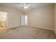 Neutral bedroom with a ceiling fan, carpeted floor and attached bath at 460 Tribble Gap Rd # 1004, Cumming, GA 30040