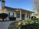 Charming single story home featuring a covered porch with decorative wreaths on the double doors at 460 Tribble Gap Rd # 1004, Cumming, GA 30040