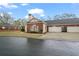 Charming brick home featuring a two-car garage, well-kept lawn and manicured landscape at 460 Tribble Gap Rd # 1004, Cumming, GA 30040