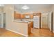 Bright kitchen featuring wood cabinets, hard wood floors, and white appliances at 460 Tribble Gap Rd # 1004, Cumming, GA 30040