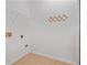 Simple laundry room with tile flooring and wire rack at 460 Tribble Gap Rd # 1004, Cumming, GA 30040