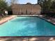 A well-maintained in-ground pool with lounge chairs and tables, perfect for relaxing outdoors at 460 Tribble Gap Rd # 1004, Cumming, GA 30040