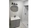 Bathroom featuring updated vanity, large mirror, and tiled shower at 1956 Shirley Sw St, Atlanta, GA 30311