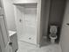 Modern bathroom with tiled walk-in shower, new vanity, and new fixtures at 1956 Shirley Sw St, Atlanta, GA 30311