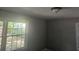 Bedroom with neutral paint and plenty of natural light from the large windows at 1956 Shirley Sw St, Atlanta, GA 30311