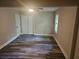 Bright bedroom with new floors, ceiling fan, and large closet at 1956 Shirley Sw St, Atlanta, GA 30311