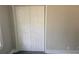 Bedroom featuring closet with sliding bi-fold doors and neutral paint at 1956 Shirley Sw St, Atlanta, GA 30311