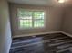 Bedroom featuring natural light from two windows and durable wood-look flooring at 1956 Shirley Sw St, Atlanta, GA 30311