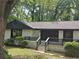 Charming single story home with landscaped front yard and inviting front porch at 1956 Shirley Sw St, Atlanta, GA 30311