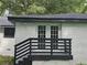 Exterior deck with black railings and white door and window trim at 1956 Shirley Sw St, Atlanta, GA 30311