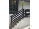 Exterior stairs with black railings and a white exterior at 1956 Shirley Sw St, Atlanta, GA 30311