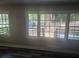 Bright living room featuring large windows offering natural light and dark hardwood flooring at 1956 Shirley Sw St, Atlanta, GA 30311