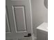 Modern powder room featuring a sleek vanity, round mirror, and marble-look tile flooring at 1956 Shirley Sw St, Atlanta, GA 30311