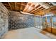 Unfinished basement area with painted walls, concrete flooring, and exposed ceiling utilities at 3595 Limberlost Sw Trl, Stockbridge, GA 30281