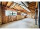 Unfinished basement with exposed ductwork, concrete floor, and framed walls ready for customization at 3595 Limberlost Sw Trl, Stockbridge, GA 30281