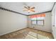 This bedroom offers a ceiling fan and window offering natural light and views of the outdoors at 3595 Limberlost Sw Trl, Stockbridge, GA 30281
