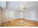 Spacious bedroom featuring hardwood floors, natural light, and multiple access doors at 3595 Limberlost Sw Trl, Stockbridge, GA 30281