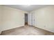 Bedroom with carpet and two access doors, with a light-colored walls at 3595 Limberlost Sw Trl, Stockbridge, GA 30281