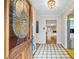 Inviting entryway with tiled floor, decorative glass front door, and view into the living room at 3595 Limberlost Sw Trl, Stockbridge, GA 30281
