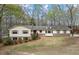 Charming ranch-style home featuring a well-maintained lawn and classic brick accents at 3595 Limberlost Sw Trl, Stockbridge, GA 30281
