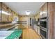 Traditional kitchen with a breakfast bar, stainless steel appliances, and plenty of cabinet space at 3595 Limberlost Sw Trl, Stockbridge, GA 30281