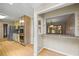Open-concept kitchen with stainless steel appliances, wood-tone cabinets, and granite countertops at 3595 Limberlost Sw Trl, Stockbridge, GA 30281