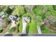 Aerial view of the house nestled among trees in a beautiful green neighborhood at 4995 Hyde Ct, Cumming, GA 30040