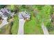 Beautiful aerial view of home with a long driveway and front yard at 4995 Hyde Ct, Cumming, GA 30040
