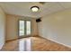 Basement room with hardwood floors and access to an outdoor patio area at 4995 Hyde Ct, Cumming, GA 30040