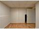Basement with hardwood floors and an unfinished wall at 4995 Hyde Ct, Cumming, GA 30040