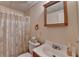 Well-lit bathroom featuring a vanity sink, toilet, and shower at 4995 Hyde Ct, Cumming, GA 30040