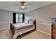 Comfortable bedroom with carpet, ceiling fan, window and craftsman trim at 4995 Hyde Ct, Cumming, GA 30040
