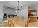 Open-concept dining room featuring hardwood floors, neutral decor, and a chandelier at 4995 Hyde Ct, Cumming, GA 30040